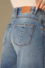 Mid Blue Artisanal Denim Contour Shape Technology Skyrise Round Up Yoke Front Center Seam Fray Hem Petite Wider Leg Jean