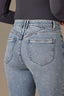 Light Blue Artisanal Denim Contour Shape Technology Skyrise Rhinestone Raw Hem Strings V-Yoke Bennett Barely Boot Jean