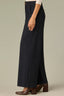Dark Indigo Contour Shape Technology Skyrise Curved Front Pockets Patch Back Angled Dart Seams Gold Contrast Seam Slit Hem Whitney Wide Leg Petite Knit Pant