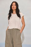 Off White Extended Double Pleated Shoulder Sleeve Scoop Neck Embroidered Logo Cased Bubble Hem Knit Top