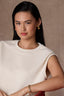Blanched Almond Sleeveless Pleated Drop Shoulder Studded Round Neck Bubble Hem Knit Top