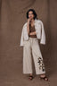 Heathered Birch Denim High Rise Slightly Arched Back Yoke Drawstring Waist Floral Applique Wide Leg Jean