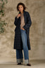 Blue Stone Multi Long Sleeve Double Button Front Flap Pocket Elongated Plaid Woven Jacket and Mid Blue Artisanal Skyrise Contour Shape Technology Fixed Cuff Wide Leg Jean and Heather Oatmeal Long Sleeve Scallop Boat Neck Crochet Embroidered Sweater