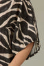 Charcoal Ecru Dolman Elbow Bubble Sleeve Split V-Neck Center Seam Straight Hem Zebra Print Woven Top