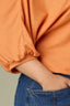 Roasted Carrot Seamless Blouson Cinched Cuff Sleeve V-Neck Center Seam Cased Hem Plus Size Woven Top